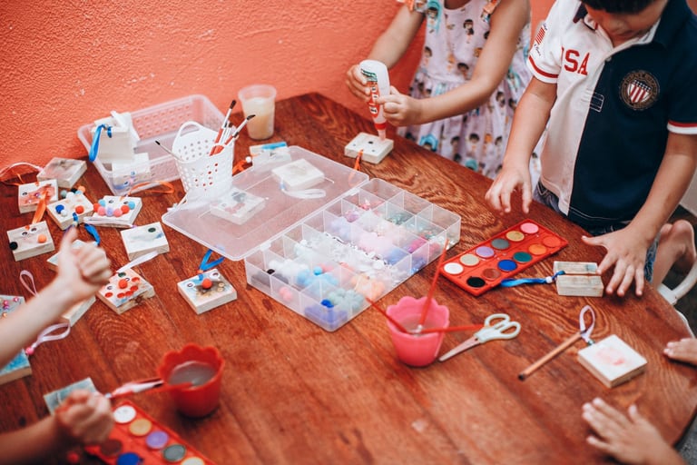 Creative children painting together at a table