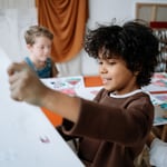 Children sharing a joyful art class